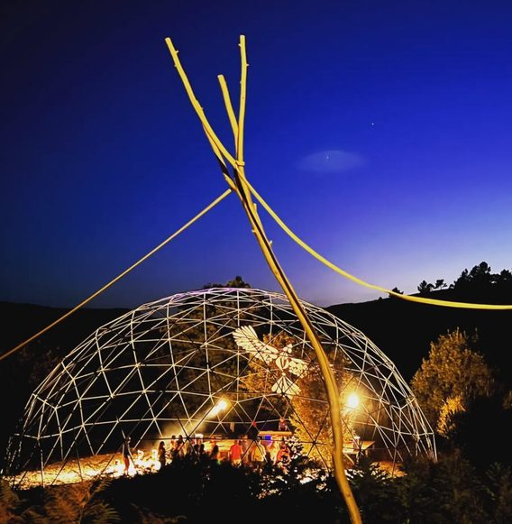 Geodesic dome lit at night